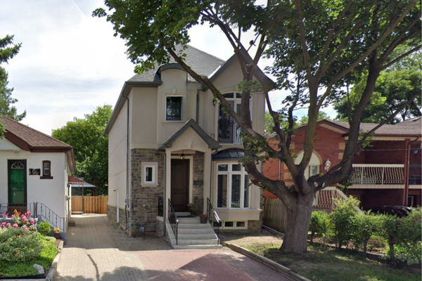 Completed custom home exterior in Rockcliffe-Smythe, designed and built by custom home builder Ridgestone Homes