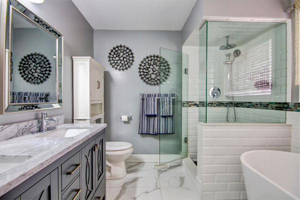Full bathroom after upgrades with vanity, tub, shower, and toilet – Bathroom Renovation Brampton