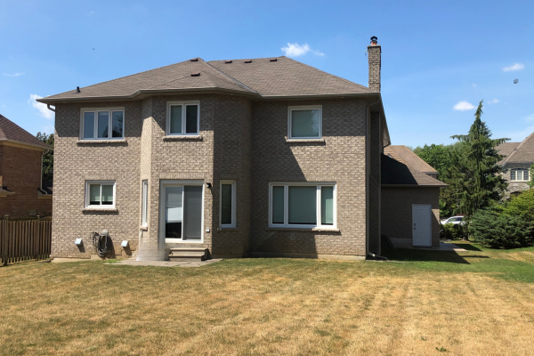 Original rear exterior and main floor layout before luxury home renovation in Richmond Hill.